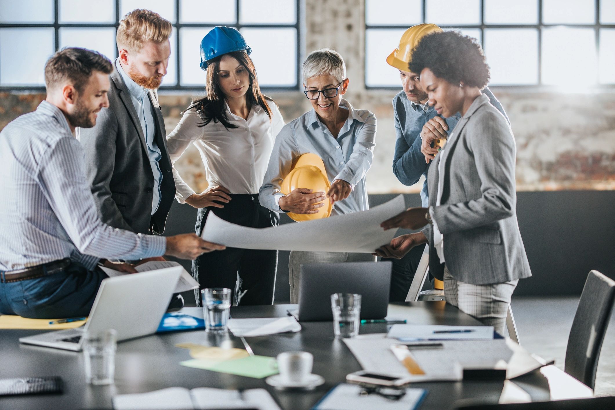 Project team reviewing plans in an office