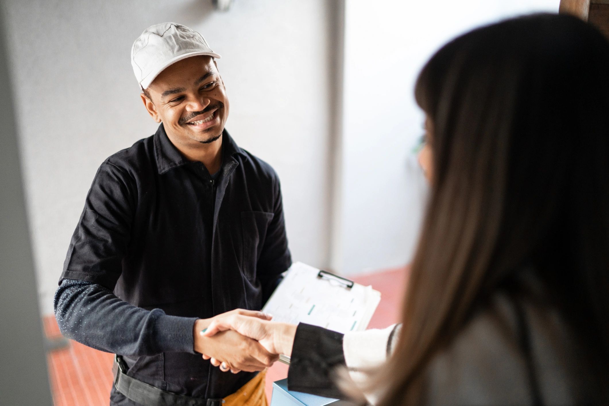 Contractor shaking hands with a homeowner
